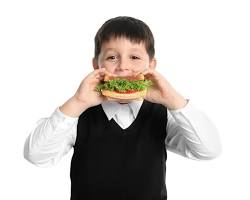 kid eating a sandwich
